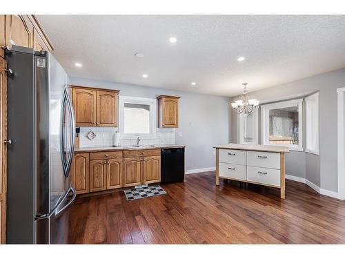 1130 Maple Avenue, Crossfield, AB - Indoor Photo Showing Kitchen With Double Sink