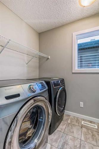 67 Legacy Glen Row Se, Calgary, AB - Indoor Photo Showing Laundry Room