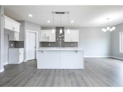 120 Sora Terrace Se, Calgary, AB - Indoor Photo Showing Kitchen With Double Sink
