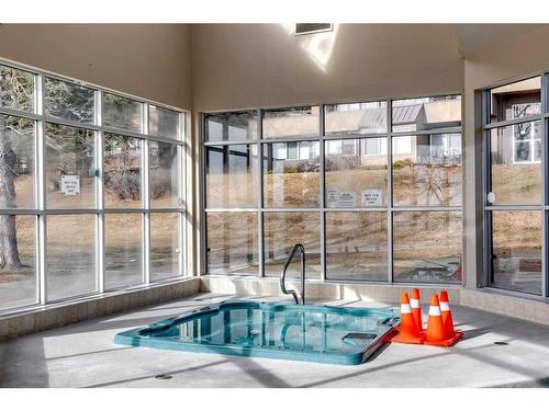 3-104 Village Heights Sw, Calgary, AB - Indoor Photo Showing Other Room With In Ground Pool