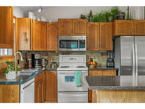 130 Settler Way, Canmore, AB - Indoor Photo Showing Kitchen With Double Sink