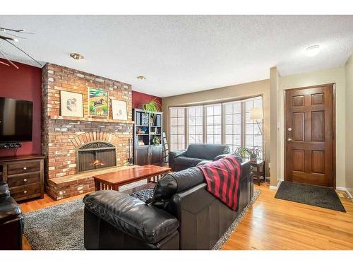 2431 Sandhurst Avenue Sw, Calgary, AB - Indoor Photo Showing Living Room With Fireplace