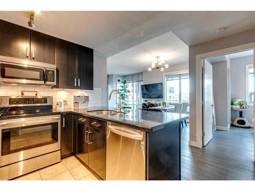 205-1410 1 Street Se, Calgary, AB - Indoor Photo Showing Kitchen With Stainless Steel Kitchen With Upgraded Kitchen