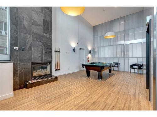 205-1410 1 Street Se, Calgary, AB - Indoor With Fireplace