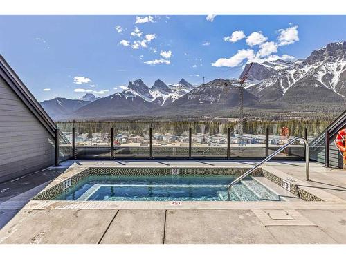 206-1315 Spring Creek Gate, Canmore, AB - Outdoor With In Ground Pool