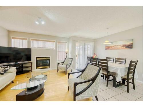 19 Taravista Crescent Ne, Calgary, AB - Indoor Photo Showing Living Room With Fireplace
