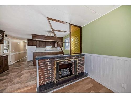2 21 A Street Close, Bowden, AB - Indoor With Fireplace