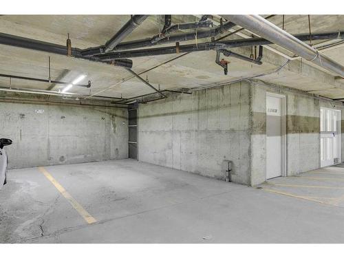 218-9449 19 Street Sw, Calgary, AB - Indoor Photo Showing Garage