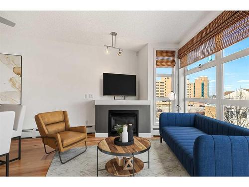 448-315 24 Avenue Sw, Calgary, AB - Indoor Photo Showing Living Room With Fireplace
