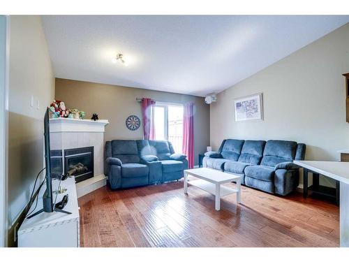 224 Crimson Lane, Chestermere, AB - Indoor Photo Showing Living Room With Fireplace