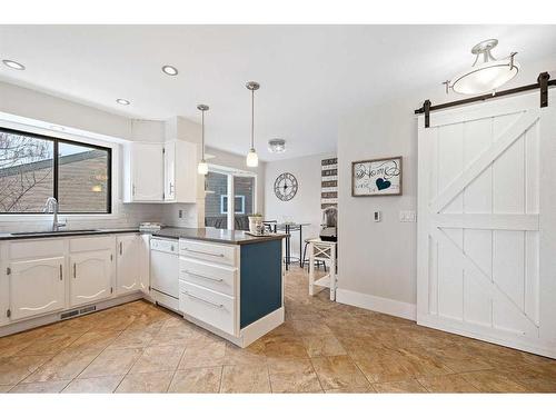 44 Millbank Close Sw, Calgary, AB - Indoor Photo Showing Kitchen With Upgraded Kitchen