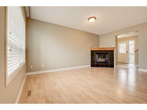 26 Royal Elm Drive Nw, Calgary, AB - Indoor Photo Showing Living Room With Fireplace