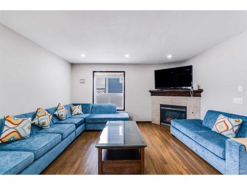 114 Saddleland Crescent Ne, Calgary, AB - Indoor Photo Showing Living Room With Fireplace
