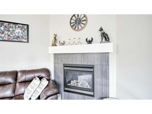 48 Auburn Springs Boulevard Se, Calgary, AB - Indoor Photo Showing Living Room With Fireplace