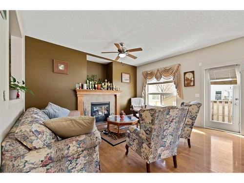 41 Taralake Heath Ne, Calgary, AB - Indoor Photo Showing Living Room With Fireplace
