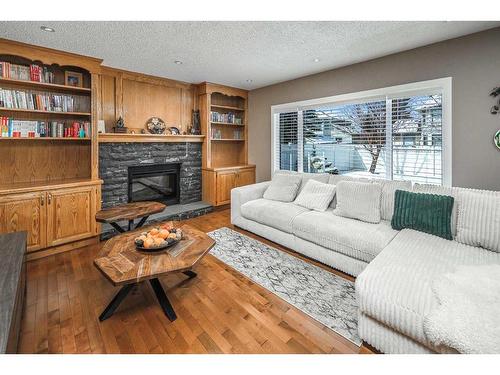 315 Hawkstone Close Nw, Calgary, AB - Indoor Photo Showing Living Room With Fireplace