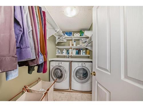 123 West Springs Way Sw, Calgary, AB - Indoor Photo Showing Laundry Room