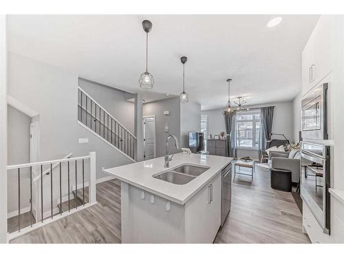 47 Crestbrook Drive Sw, Calgary, AB - Indoor Photo Showing Kitchen With Double Sink With Upgraded Kitchen
