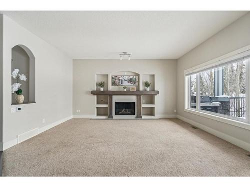 226 Crystal Green Place, Okotoks, AB - Indoor Photo Showing Living Room With Fireplace