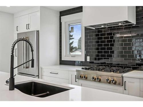 36 Maple Court Crescent Se, Calgary, AB - Indoor Photo Showing Kitchen With Double Sink