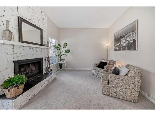 40-99 Midpark Gardens Se, Calgary, AB - Indoor Photo Showing Living Room With Fireplace
