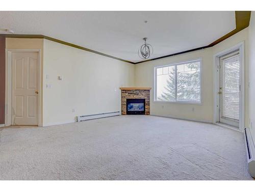 305-345 Rocky Vista Park Nw, Calgary, AB - Indoor With Fireplace