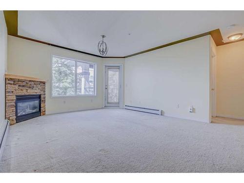 305-345 Rocky Vista Park Nw, Calgary, AB - Indoor With Fireplace
