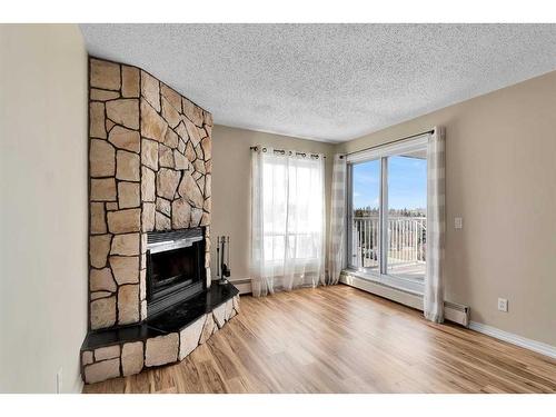 505-1919 17 Avenue Sw, Calgary, AB - Indoor Photo Showing Living Room With Fireplace