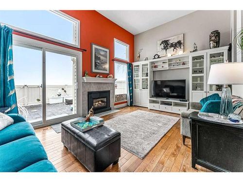 718 Queenston Terrace Se, Calgary, AB - Indoor Photo Showing Living Room With Fireplace