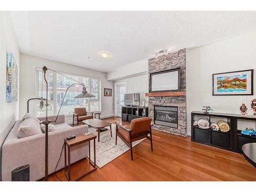 118-35 Inglewood Park Se, Calgary, AB - Indoor Photo Showing Living Room With Fireplace