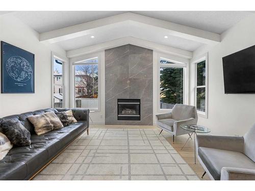 859 Tuscany Drive Nw, Calgary, AB - Indoor Photo Showing Living Room With Fireplace