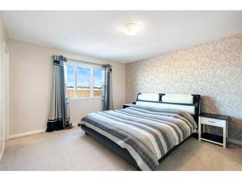 101 Mount Rae Heights, Okotoks, AB - Indoor Photo Showing Bedroom