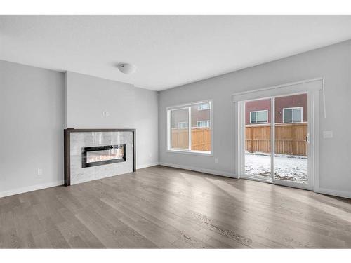 563 Savanna Landing Ne, Calgary, AB - Indoor Photo Showing Living Room With Fireplace