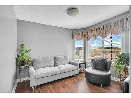100 Rainbow Falls Row, Chestermere, AB - Indoor Photo Showing Living Room