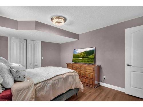 100 Rainbow Falls Row, Chestermere, AB - Indoor Photo Showing Bedroom