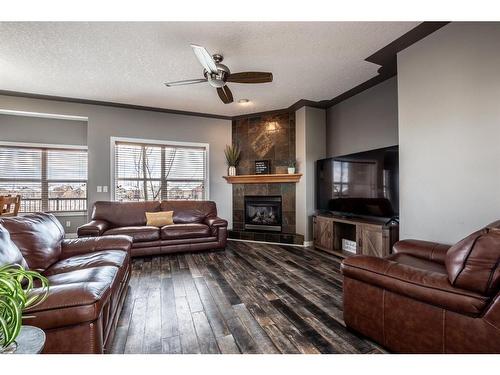 1518 High Park Drive Nw, High River, AB - Indoor Photo Showing Living Room With Fireplace