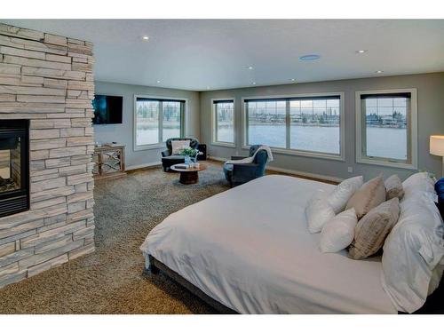 169 Chapala Point Se, Calgary, AB - Indoor Photo Showing Bedroom With Fireplace