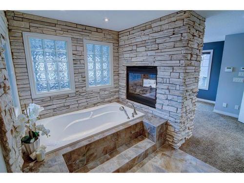 169 Chapala Point Se, Calgary, AB - Indoor Photo Showing Bathroom With Fireplace