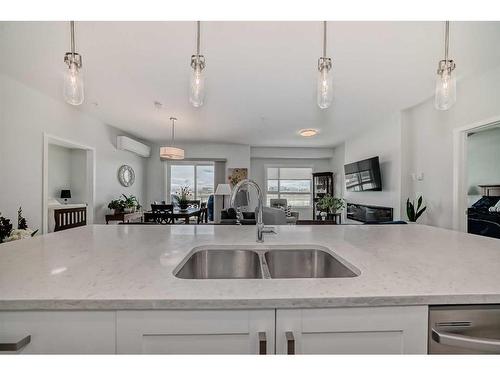 205-360 Harvest Hills Way Ne, Calgary, AB - Indoor Photo Showing Kitchen With Double Sink