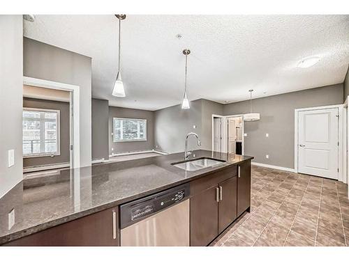 135-23 Millrise Drive Sw, Calgary, AB - Indoor Photo Showing Kitchen With Double Sink