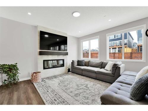 340 Lucas Way Nw, Calgary, AB - Indoor Photo Showing Living Room With Fireplace