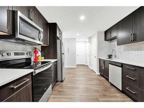 340 Lucas Way Nw, Calgary, AB - Indoor Photo Showing Kitchen With Upgraded Kitchen