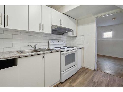 57 Martinview Crescent Ne, Calgary, AB - Indoor Photo Showing Kitchen With Double Sink