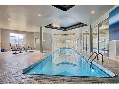 4-101 Village Heights Sw, Calgary, AB - Indoor Photo Showing Other Room With In Ground Pool