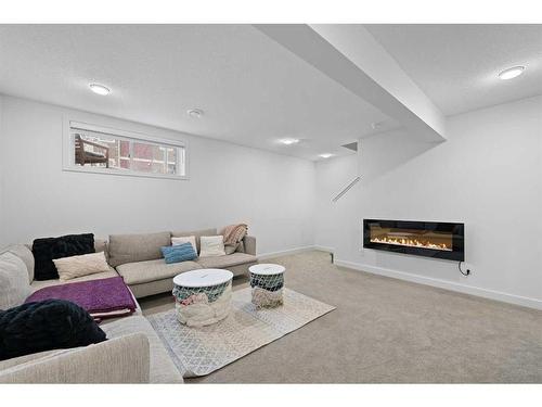 54 Walgrove Plaza Se, Calgary, AB - Indoor Photo Showing Living Room With Fireplace