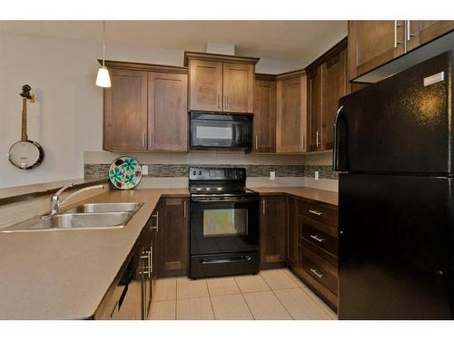 416 Ranch Ridge Meadow, Strathmore, AB - Indoor Photo Showing Kitchen With Double Sink
