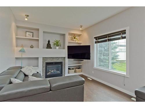 416 Ranch Ridge Meadow, Strathmore, AB - Indoor Photo Showing Living Room With Fireplace
