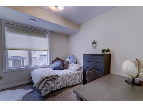 64 Cranbrook Drive Se, Calgary, AB - Indoor Photo Showing Bedroom