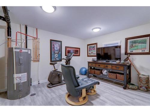 64 Cranbrook Drive Se, Calgary, AB - Indoor Photo Showing Gym Room