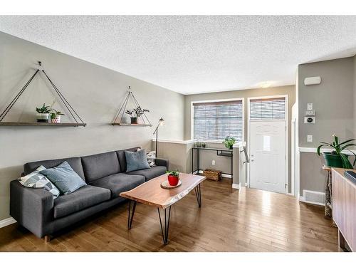 127 New Brighton Villas Se, Calgary, AB - Indoor Photo Showing Living Room